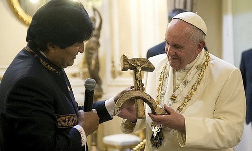 Bolivian President Evo Morales presents Pope Francis with a wooden crucifix carved in the form of a hammer and sickle