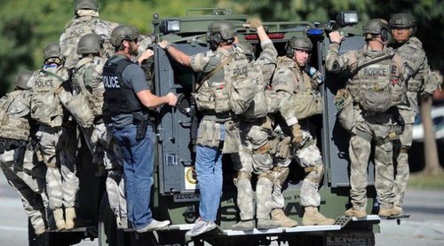White men with guns--they're the San Bernardino SWAT team.
